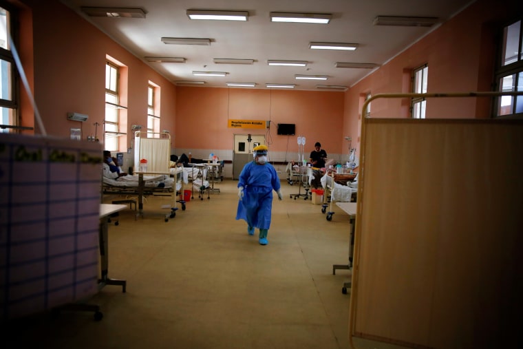 Image: A nurse walks through a ward of coronavirus patients at Dos de Mayo hospital in Lima, Peru, on April 16, 2020.
