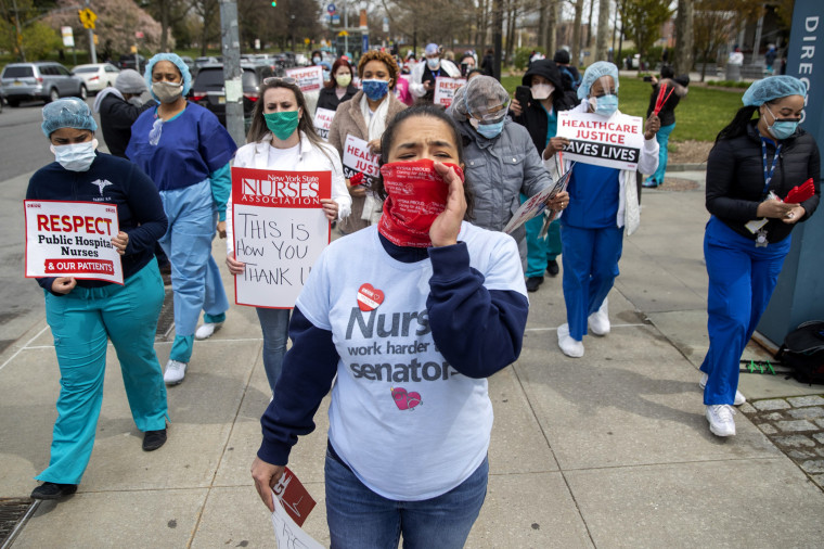 Image: Nurses hold a demonstration against a new sick leave policy outside of Jacobi Medical Center in the Bronx, N.Y., on April 17, 2020.