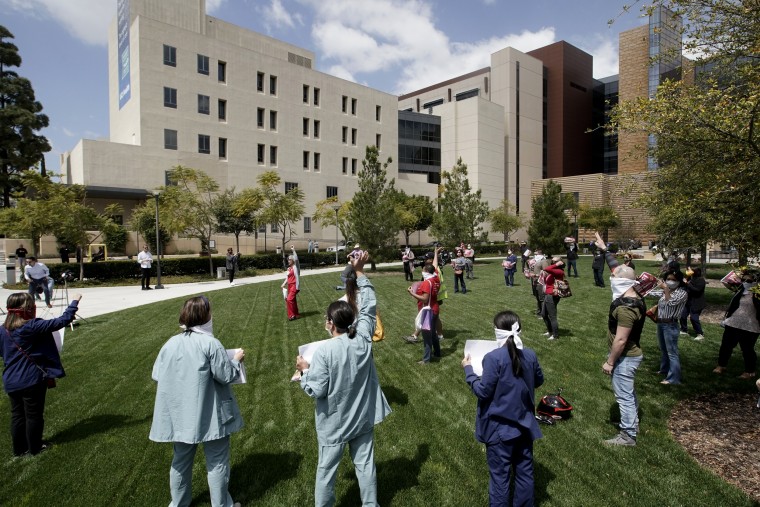 Image: Nurses at UCI Medical Center protest the lack of personal protective equipment available in Orange, Calif., on April 3, 2020.