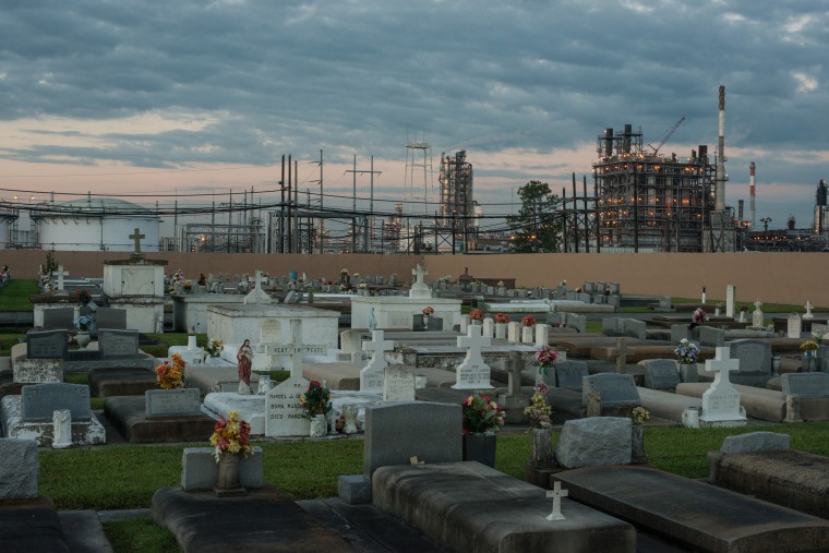 A cemetery stands in contrast to the chemical plants that surround it in "Cancer Alley" near Baton Rouge, La.