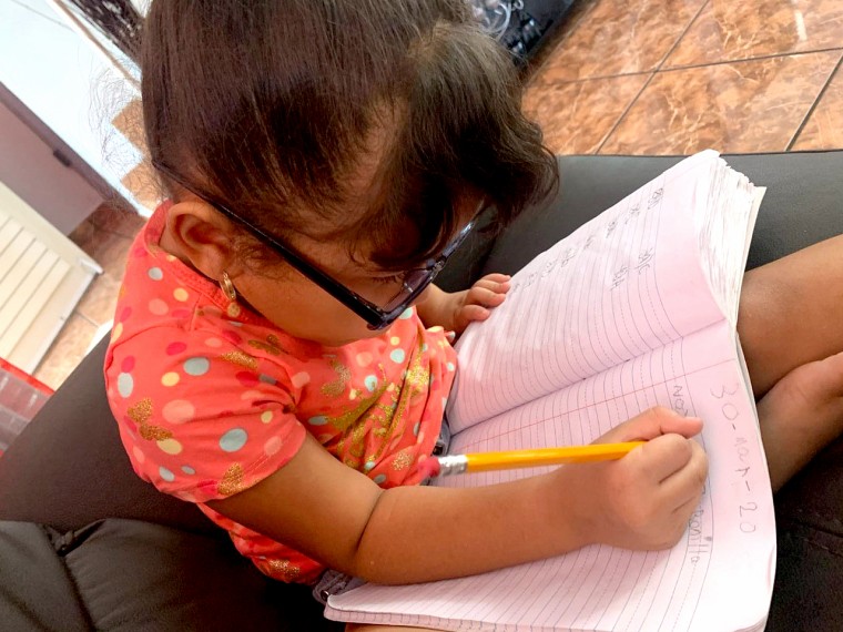 Elementary school students in San Juan, Puerto Rico use modules to learn at home as schools remain closed due to coronavirus.