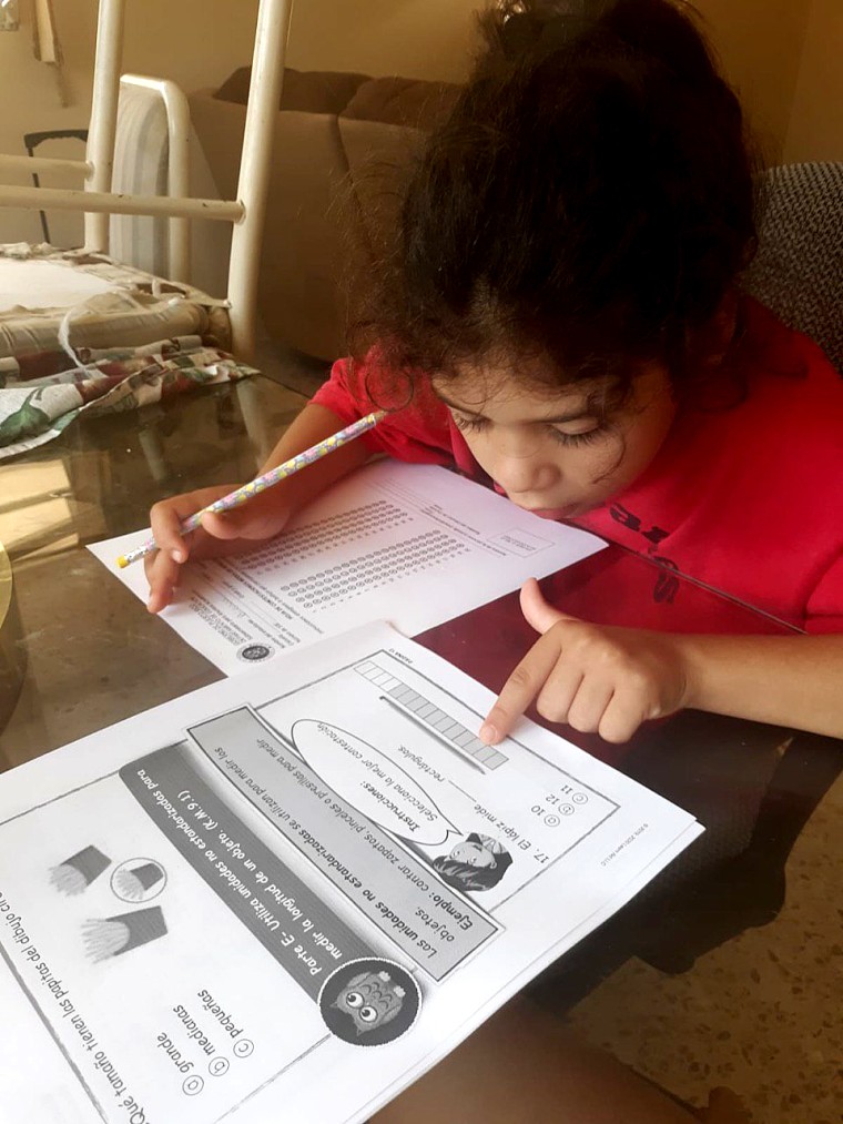 Elementary school students in San Juan, Puerto Rico use modules to learn at home as schools remain closed due to coronavirus.