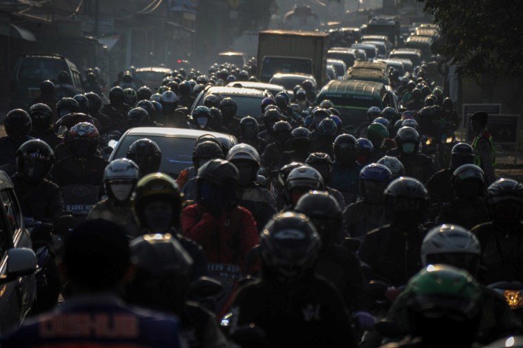 Image: Drivers wait in lines for a check in Bandung, Indonesia on Thursday where during large-scale restrictions are in place to prevent the spread of coronavirus.