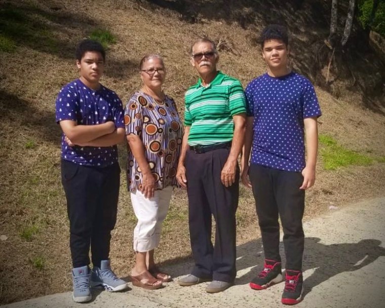 Haydee Del Valle with her husband and children in Caguas, Puerto Rico.