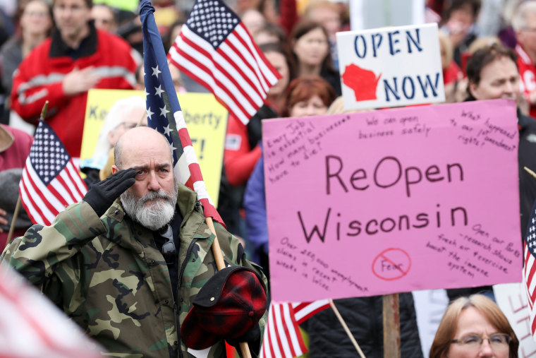 Image: Protesters against the state's extended stay-at-home order demonstrate in Madison