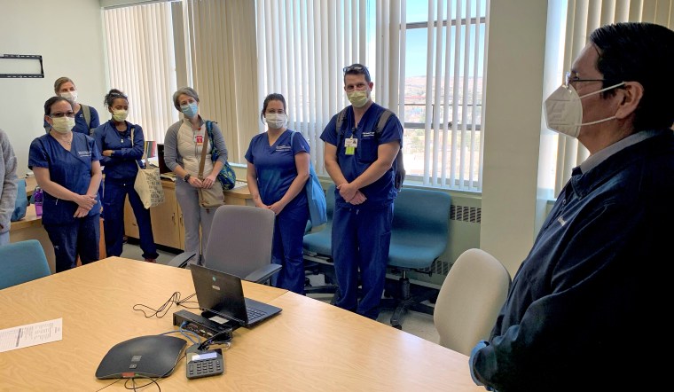Navajo Nation President Jonathan Nez, right, thanks members of the California medical team working at Gallup Indian Medical Center on the Navajo reservation.