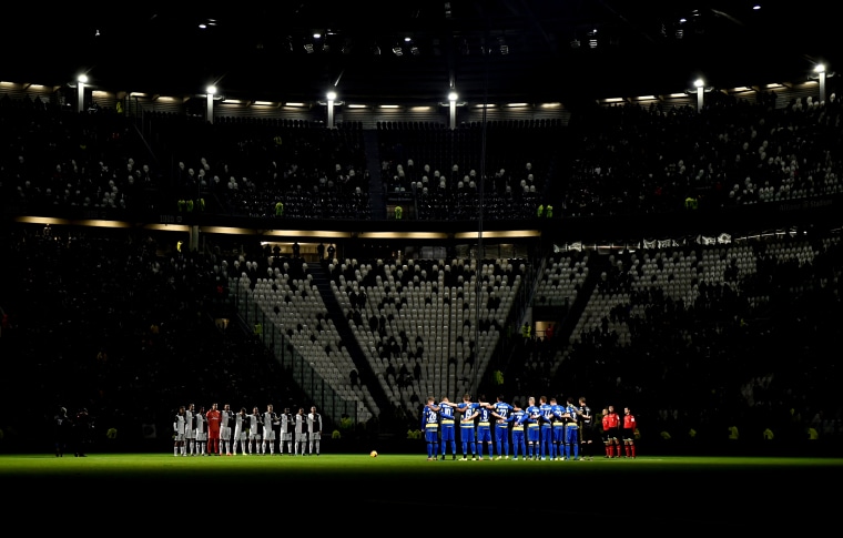 Image: Juventus and Parma players pause before the start of a Serie A match in Turin, Italy, on Jan. 19, 2020.