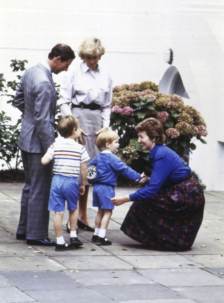 A three-year-old Duke of Sussex, then Prince Harry, shakes the hand of headmistress Jane Mynors as he arrives for his first day of nursery school with his parents, the Prince and Princess of Wales, and his brother Prince William, at Chepstow Villas in west London with a Thomas the Tank Engine bag.