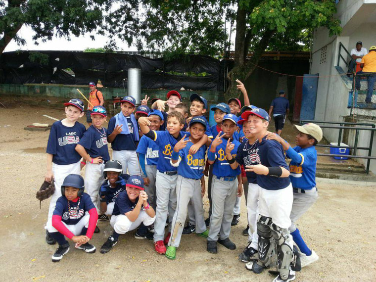 With teammates and opponents at a tournament in Santo Domingo, Dominican Republic in 2013. 