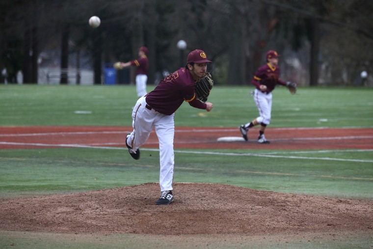 Warming up to pitch in a 2019 high school game in Seattle, Washington. 
