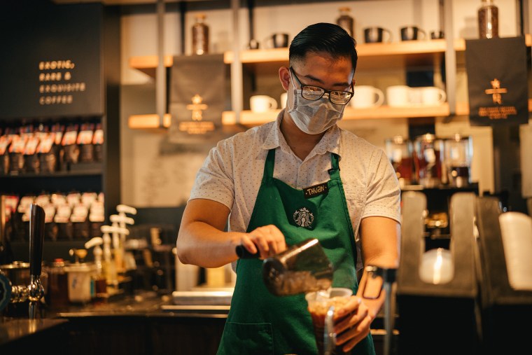 "Partners are also required to wear facial coverings during their shifts and continue to frequently wash their hands," said Starbucks. "They also have the option to wear gloves."
