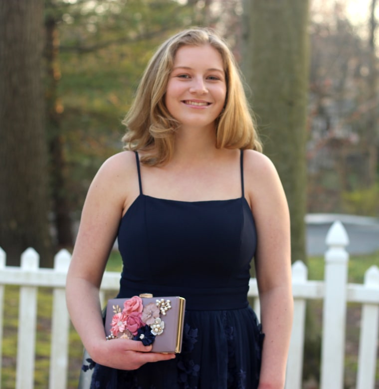 Ellie Anderson, 16, had searched for the perfect dress for her Junior Prom. She was able to wear it when her siblings threw her a surprise prom in the basement of her family's home in Montgomery County, Pennsylvania. 