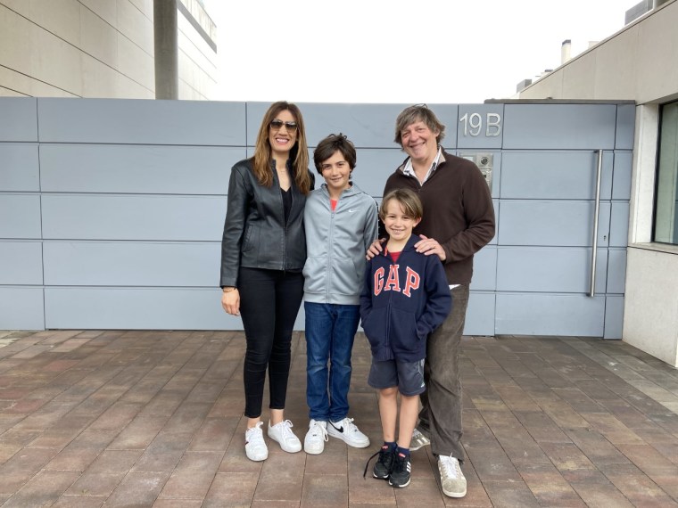 Image: Layla Block, 42, Sam Block, 10, Elias Block, 7, Neil Block, 54, standing outside their apartment complex in the northwest Madrid neighbourhood of Pozuelo.