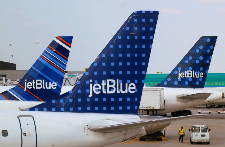 Image: JetBlue Airways aircrafts are pictured at departure gates at John F. Kennedy International Airport in New York.