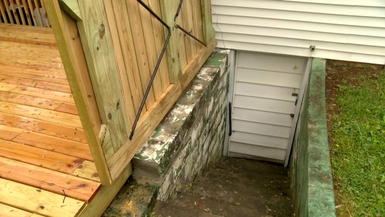 Image: Bowling Green Mayor Bruce Wilkerson said he found a woman hiding in a crawl space in his cellar at his home in Kentucky.