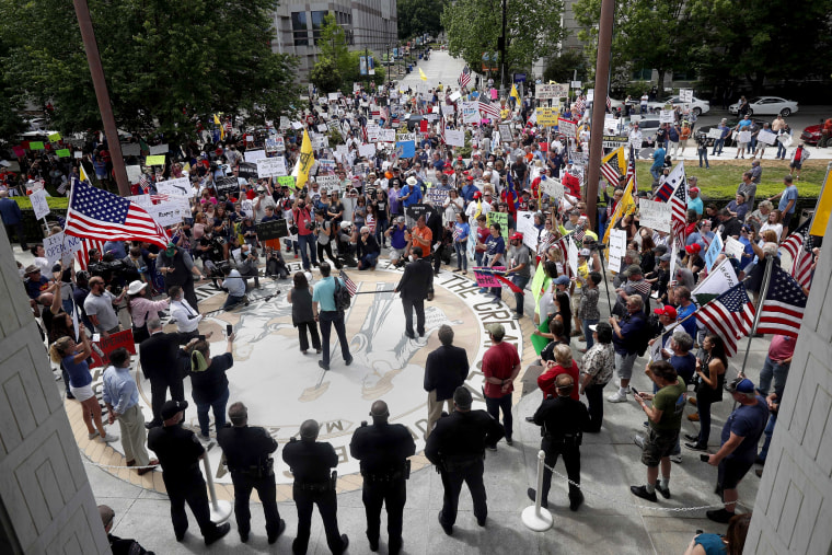 Image: People gather outside of the North Carolina Legislative Building to protest stay-at-home orders in Raleigh on April 28, 2020.