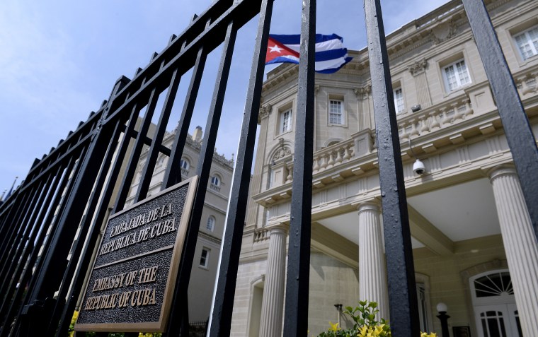 Image: The Cuban flag flies in front of the country's embassy after 54 years July 30, 2015 in Washington, DC.
