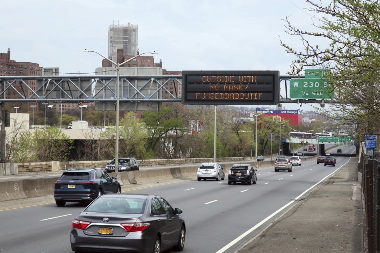 A sign over Interstate 87 in the Bronx on Wednesday tells motorists to wear masks when venturing outside.