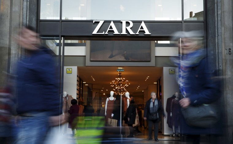 People walk past a Zara store in Barcelona