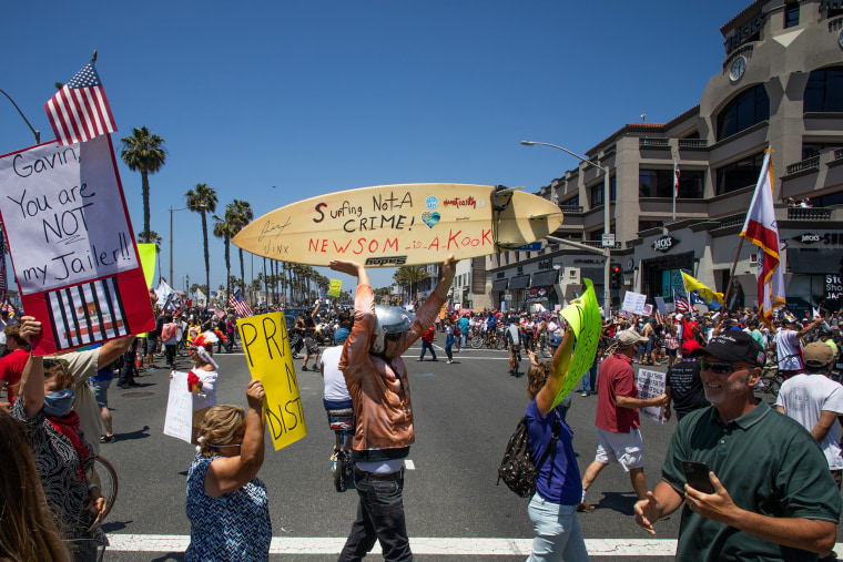 Image: Protest To Reopen California Businesses, Beaches, And Parks Held In Huntington Beach