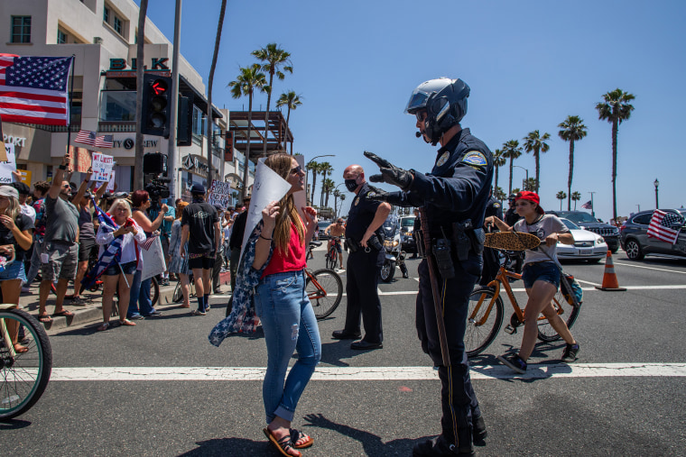 Image: Protest To Reopen California Businesses, Beaches, And Parks Held In Huntington Beach