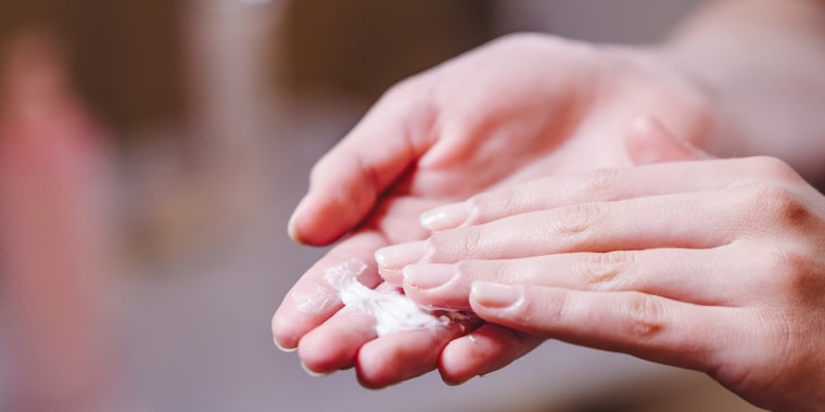 Hand Skin Care. Close Up Of Female Hands Applying Cream, Lotion. Beautiful Woman Hands With Manicure. Nails Applying Cosmetic. Hand Cream On Soft Silky.