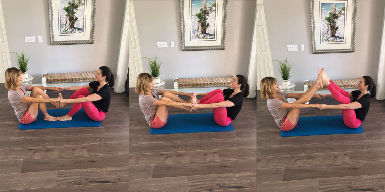 Two Yoga Students Balancing In Symmetric Pose Side View High-Res Stock  Photo - Getty Images