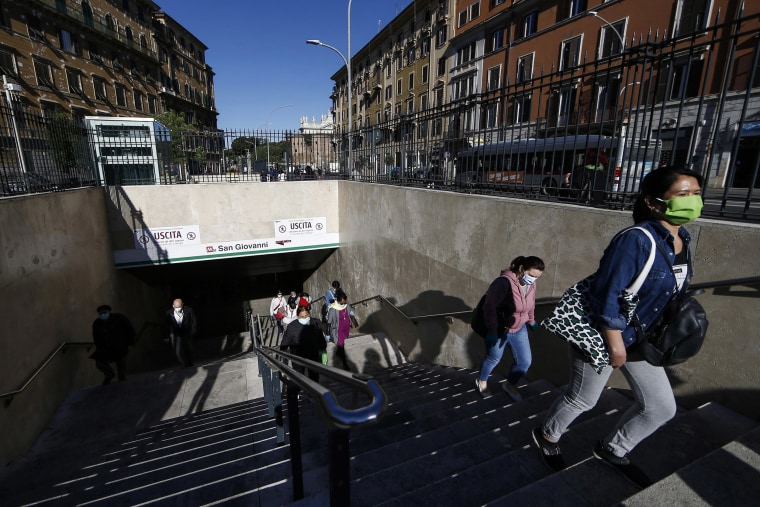 Image: People flow out of Rome's San Giovanni metro station on Monday.