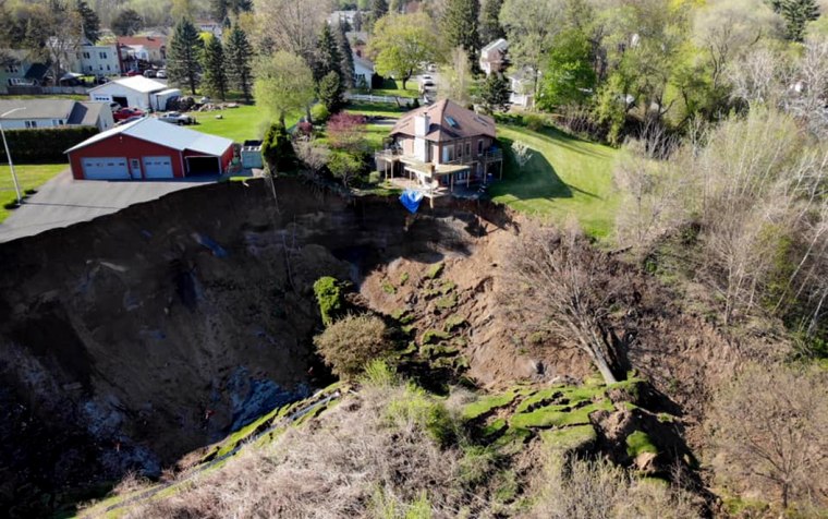 Image: A landslide in Waterford, N.Y., left a house teetering on the edge of a cliff on May 3, 2020.