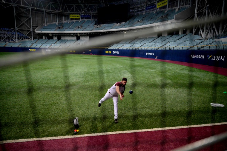 Image: Kiwoom Heroes pitcher Jake Brigham attends a training session at Gocheok Sky Dome in Seoul on April 26, 2020.