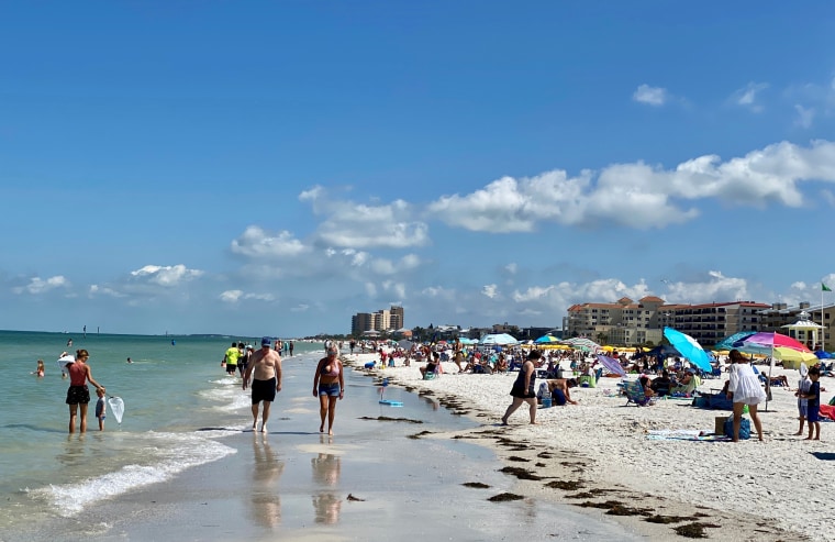 Image: People gather at Clearwater Beach after Florida eased social distancing restrictions on May 4, 2020.