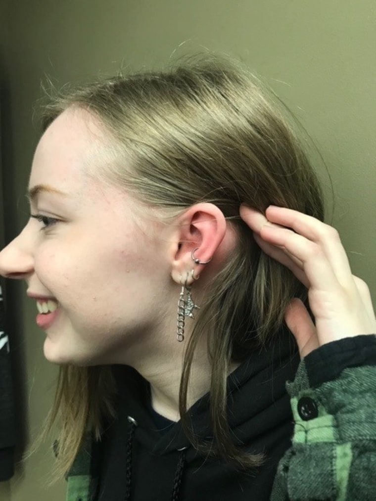 Julia Mann showing off her new ear piercings.
