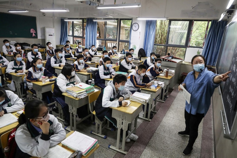 Image: Students in Wuhan return to their classrooms on Wednesday for the first time since the lockdown began.