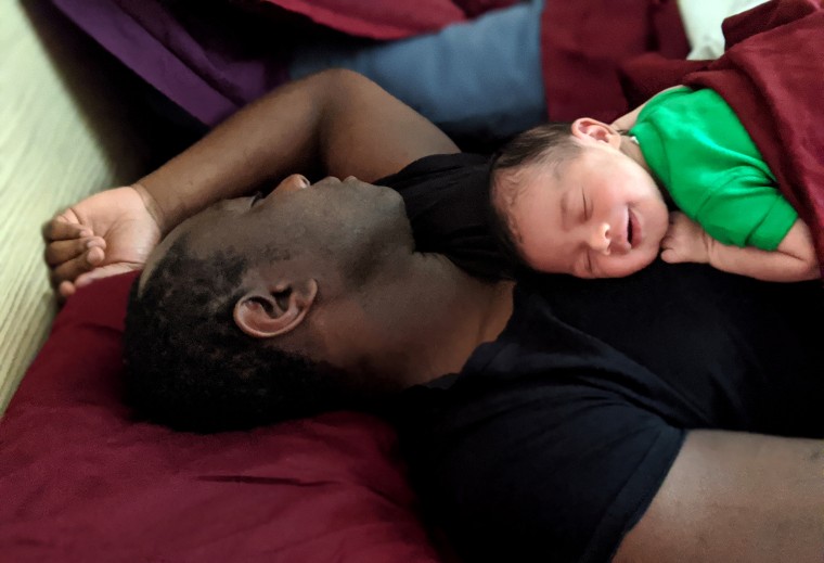 Jamal Gathers Sr., seen with his son Henry, has weekly Zoom sessions with his therapist to cope with the challenges of having a newborn in a pandemic. "Bourbon helps, too," Gathers joked.