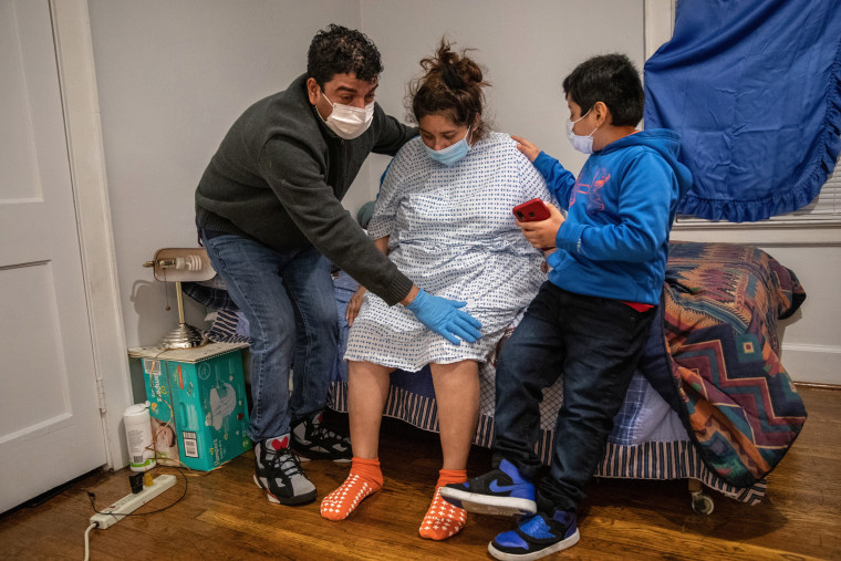 Image: Immigrant Mother And Family Suffer With COVID-19 As Teacher Cares For Their Healthy Newborn