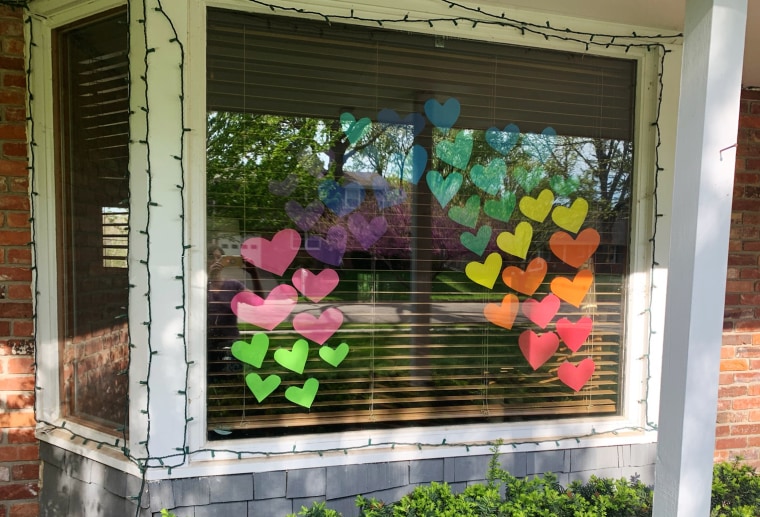 A PFLAG member in Lincoln placed hearts on their windows.