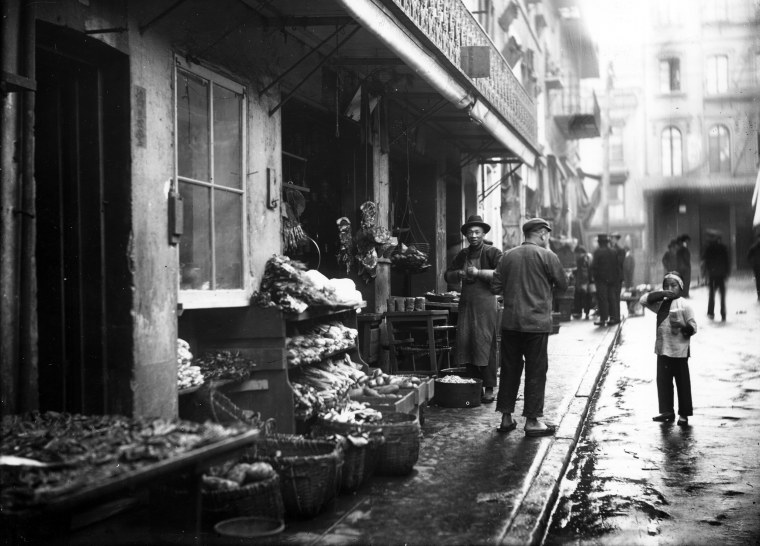 Storefront of Chinatown meat and vegetable market, San Francisco, California, 1895.