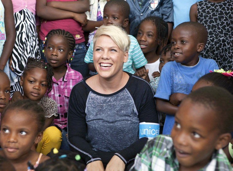 Pink visits a UNICEF-supported primary school and playground in Port-au-Prince, Haiti, on July 24, 2014.