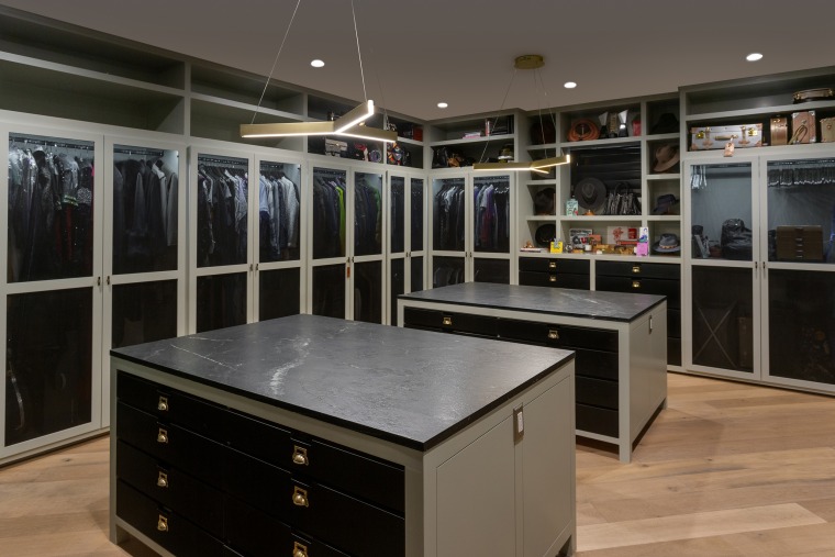 A gigantic walk-in closet offers all the storage space one could ask for. 