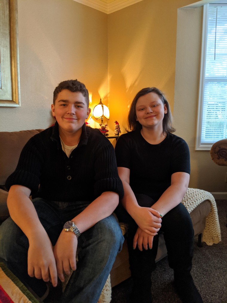 Anthony Lawson, 13, sits with his sister, Teddi, 12, for a photo at the end of 2019.