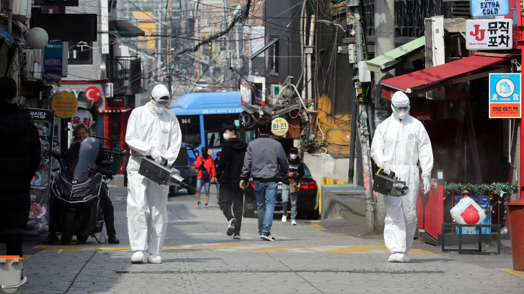 Image: Quarantine workers spray disinfectants at night spots of Itaewon neighborhood, following the coronavirus disease (COVID-19) outbreak, in Seoul