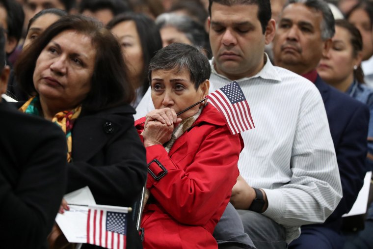 Image: Immigrants participate in a naturalization ceremony to become new U.S. citizens in Los Angeles