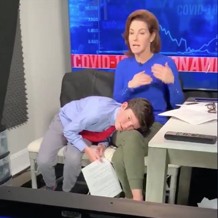 MSNBC host Stephanie Ruhle delivered a live report with her son, Reese, secretly sprawled across her lap. 