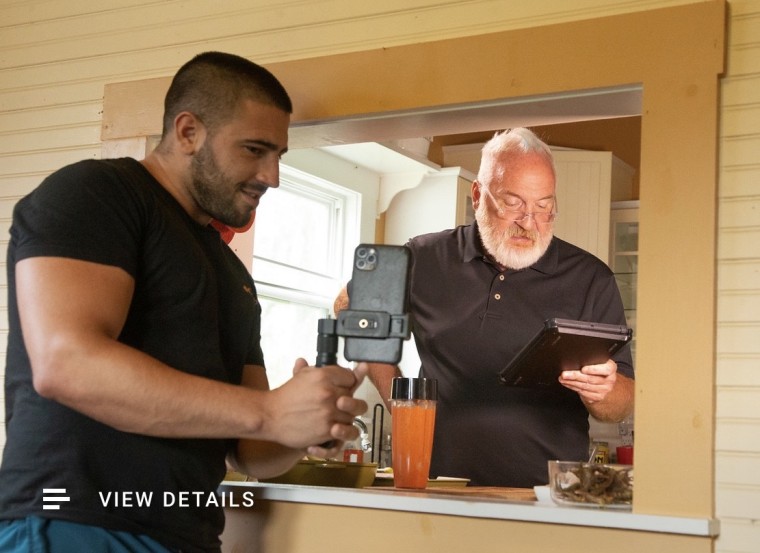 Lucas Cancelier and Art Smith working on an Instagram cooking demo showcasing great dishes and Smith's new, healthy self.