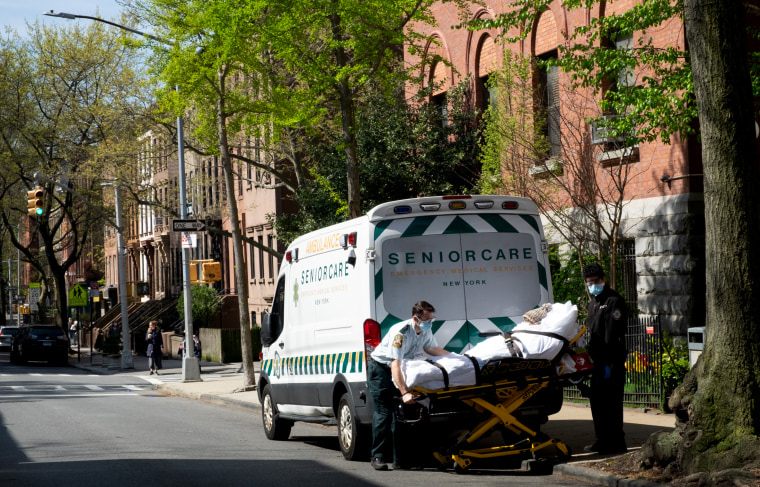 Image: Two medical workers transport and elderly patient from a nursing home in Brooklyn, N.Y., on April 24, 2020.