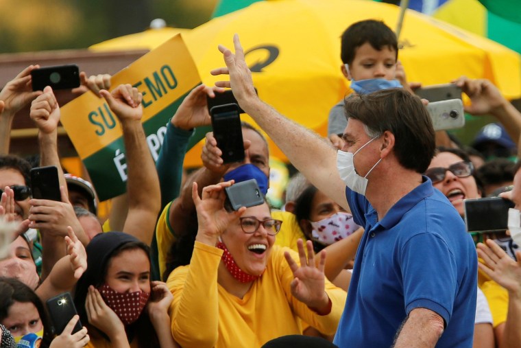 Image: Brazil's President Jair Bolsonaro greets supporters during a protest against the President of the Chamber of Deputies Rodrigo Maia, Brazilian Supreme Court, quarantine and social distancing measures in Brasilia, Brazil on Sunday.