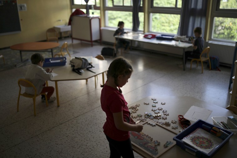 Image: Children social distance in a classroom at the Saint-Tronc Castelroc primary school in Marseille, France, on May 14, 2020.