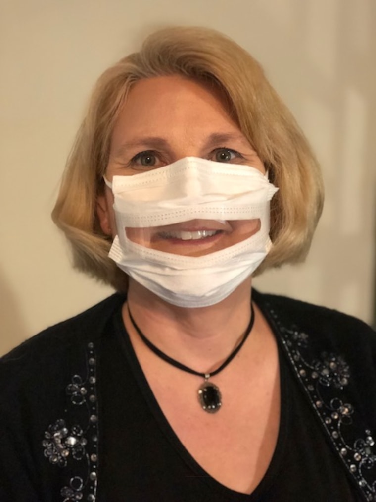 Image: Dr. Anne McIntosh, President of Safe'N'Clear, Inc., wearing a communicator mask.