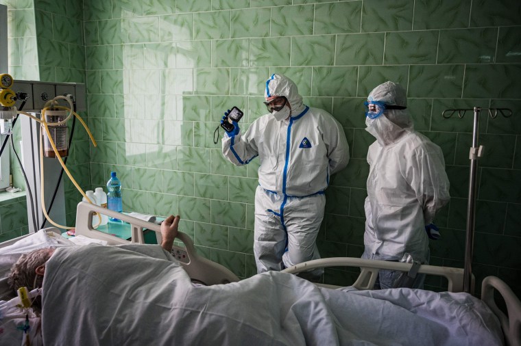 Image:A doctor wearing personal protective equipment works in the intensive care unit with COVID-19 patients at Vinogradov City Clinical Hospital in Moscow on Sunday.