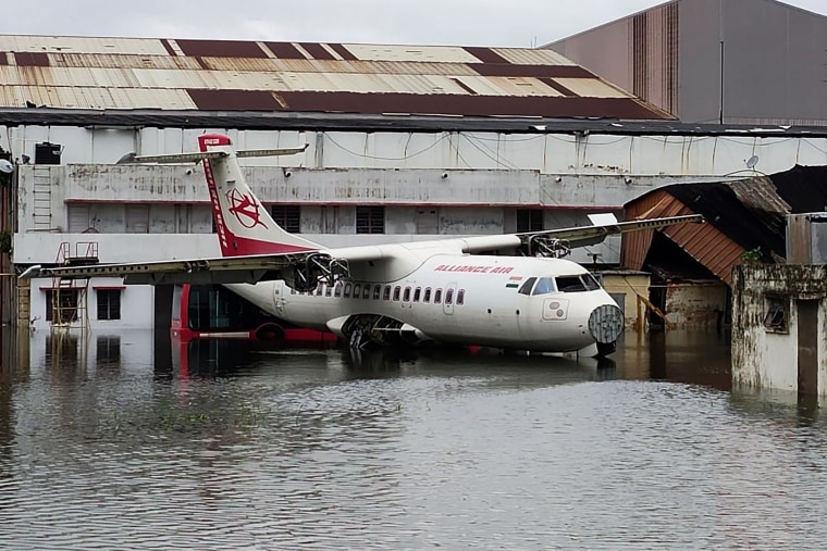 Image: An aircraft is parked at the flooded Netaji Subhas Chandra Bose International Airport after the landfall of cyclone Amphan in Kolkata